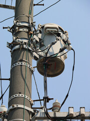 A closeup image of the transformer cable work on the utility pole.