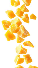 Freeze-dried mango chunks falling down on transparent background


