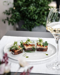 An Elegant Culinary Presentation featuring Exquisite Wine and Gourmet Dishes
