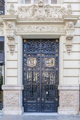 Ornate Historic Iron Door With Classical Sculptures in Valencia Spain. Elaborate Entrance, Architectural Details, Traditional Design, City Life