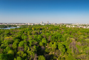 King Michael I Park (former Herastrau Park) in Bucharest. Aerial photo with the biggest park in Bucharest. Green forest lake landscape in Bucharest, Romania, during a summer beautiful day.