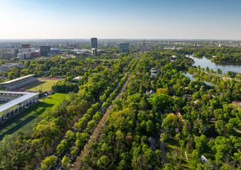 King Michael I Park (former Herastrau Park) in Bucharest. Aerial photo with the biggest park in Bucharest. Green forest lake landscape in Bucharest, Romania, during a summer beautiful day.
