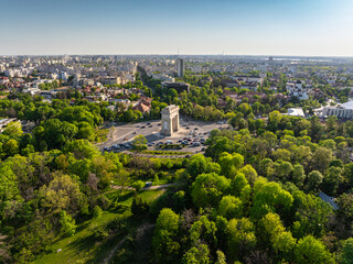 Aerial Bucharest. Arch of Triumph, Kiseleff boulevard and Herastrau Park in an aerial photo taken in the north part of Bucharest, Romania, during a summer day. Bucharest from above.
