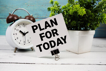 Plan For Today  text written on paper card with alarm clock on wooden background