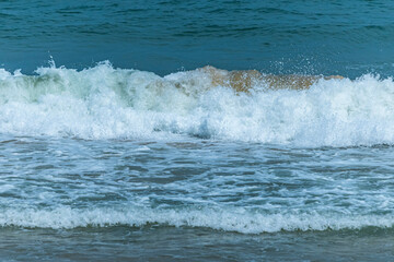The blue sea on the beach