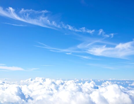 High-altitude view of a vast blue sky with clouds