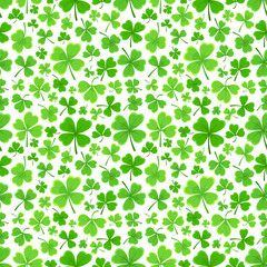 Shamrock or clover leaf flat design green seamless pattern falling leaves on white background vector illustration. Irish holiday celtic St Patrick day motif seamless pattern with shamrock clover leaf.