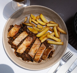 Spanish secreto iberico - iberian pork in sweet wine with stewed vegetables. High quality photo