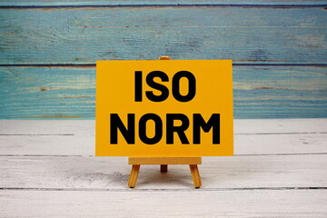ISO NORM text written on paper card on wooden background