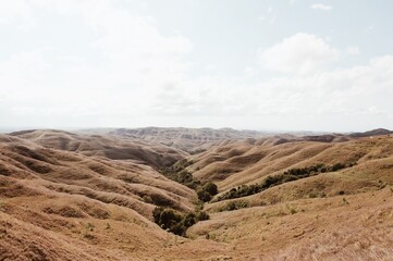Experience the mesmerizing rolling hills of Bukit Wairinding in Sumba, Indonesia. A unique and breathtaking landscape perfect for travel inspiration. 