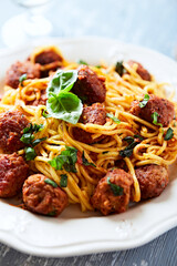 Spaghetti Pasta with Meatballs and fresh Basil. Close up.