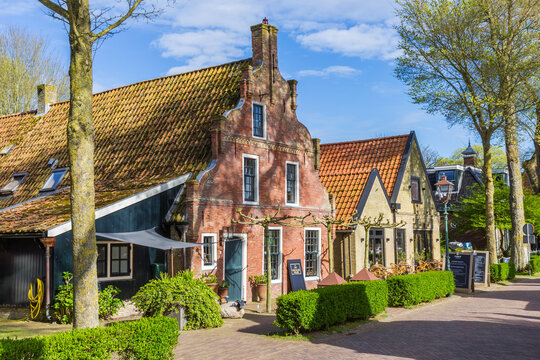 AMELAND, NETHERLANDS - APRIL 18, 2025: Historic houses at the central street of Nes, Ameland