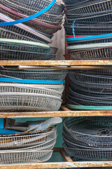 Protective fan grilles for repairing a fan in an outdoor workshop, Thailand