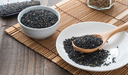 image of sesame seeds in small plates on the table. background screen.