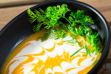 Spicy pumpkin soup puree with ginger. Recipe: roast pumpkin in olive oil, add vegetable broth, beat...