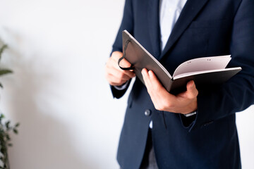 Close-up of a planner with work notes. Concept of organization, efficiency, and planning.