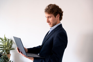 Executive planning strategies in front of his laptop