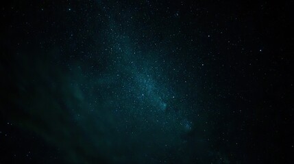Fototapeta premium The pitch-black night sky, with the visible Milky Way at its center, presents an eerie and mysterious atmosphere, perfect for space-travel or cosmic-event imagining.