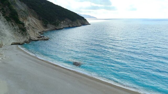 Aerial drone view of Myrtos Beach, Kefalonia, Greece with deep azure and turquoise waters, white rocky sandy shores under bright sunny skies in Europe&rsquo;s stunning island paradis