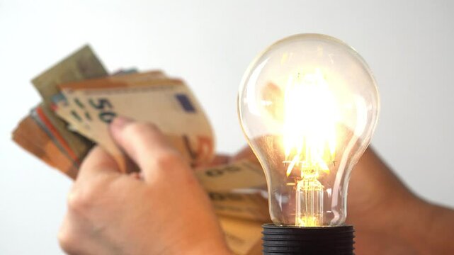 Eoro Money Counting, Turn On the Light in a Room, Money Price Electricity Concept, Invoice, Tax for Turning the Light On a Led Bulb, Cost for Turns the Light Off at Home, Pull Switch On Off