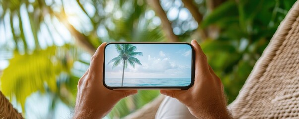 A person relaxing in a hammock views a tropical scene on their phone surrounded by greenery.