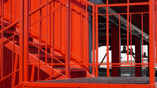 Red steel stairs background with industrial urban architecture and simple tones