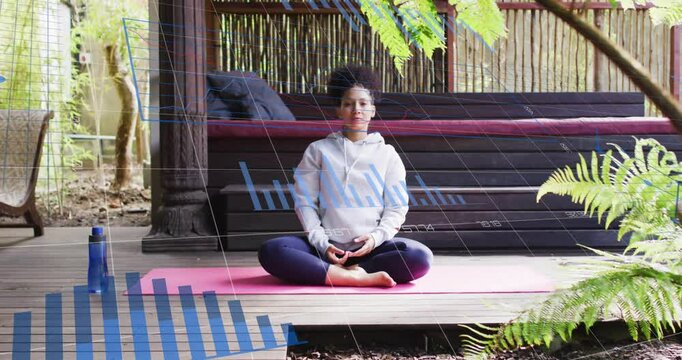 Practitioner holding meditation pose initiating lateral stretch on pink yoga mat for fitness