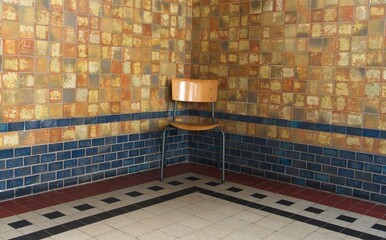 Chair in the corner of a beautifully tiled room