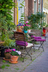 Deventer the Netherlands 19.05.2025 A pink metal table and chairs against the background of a wooden wall in the Dutch city of Deventer. High quality photo. High quality photo
