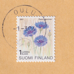 Flower Cornflower (Centaurea cyanus) on a 2001 Finland postage stamp. The postmark says Oulu