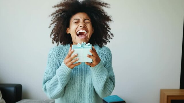 Joyful unboxing: woman's ecstatic expression with gift in exciting series of reactions
