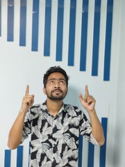 portrait of a young man standing in front of a wall