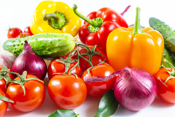 Mix of colorful vegetables - bell peppers,  tomatoes, cucumbers, onions and garlic.