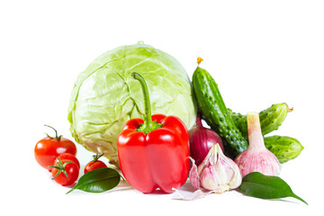 Mix of colorful vegetables - bell pepper, cabbage, tomatoes, cucumbers, onions and garlic.