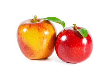 Shiny juicy red apples with leaves isolated on white background.
