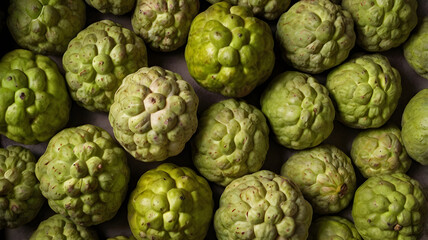 Obraz premium Cherimoya Custard apples sold in Mumbai, India, Asia. Tropical fruits. Top view. 
