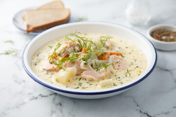 Salmon soup with cream and dill