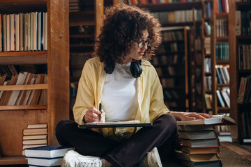 Beautiful woman is in the library
