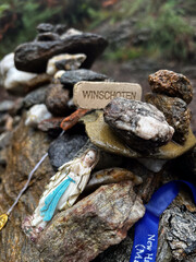 Serra da Labruja, near cross of the dead, pebbles with inscriptions and  objects on the mountain of the witch along the pilgrimage on the road to Santiago in Portugal