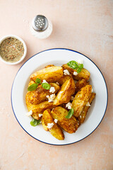 Roasted potato wedges with Feta cheese