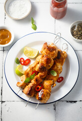Chicken skewers with peanut and lime