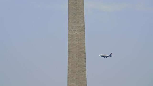 Landmark Monument with Plane Passing