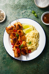 Chicken skewers with couscous and lime