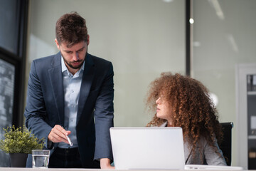 Business corporate team brainstorming, planning strategy having a discussion Analysis investment researching with chart at office desk documents in office.