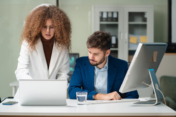 Diverse professionals collaborate on project analysis with financial graphs. Strategic teamwork and insights drive company growth and success.