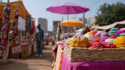 Colorful yarn balls are displayed on a market stall table, creating a vibrant and enticing scene that captures the essence of a bustling marketplace with shoppers and vendors in the background