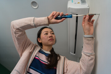 Woman engaging in home DIY repair project