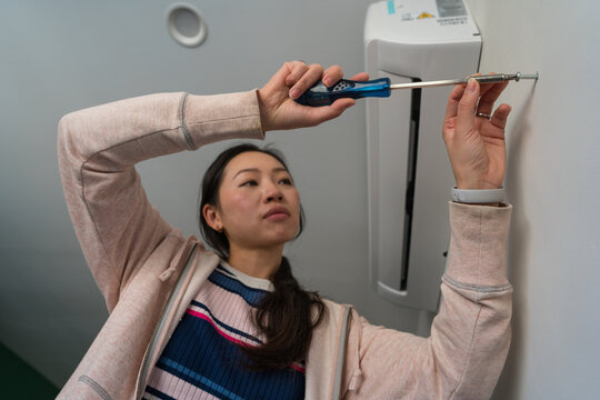 Woman engaging in home DIY repair project