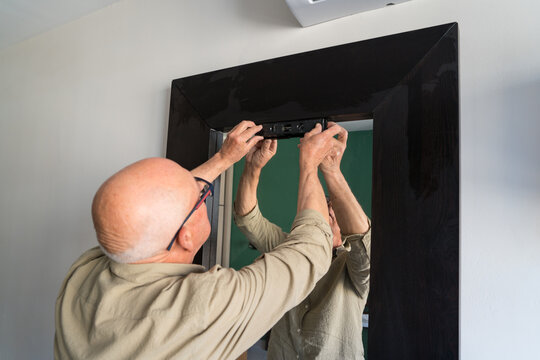 Elderly man engaging in DIY home maintenance
