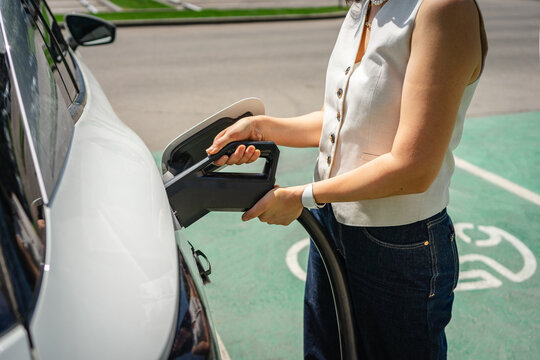 Charging an electric vehicle in a modern urban setting
